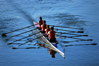 ca. 2001 --- Rowers Rowing Boat --- Image by © Royalty-Free/Corbis